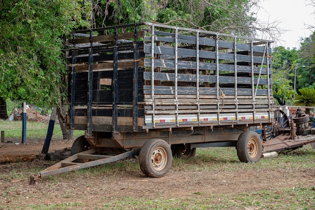 Itaja, Goias, Brazil - 10 15 2021: Small trailer with grid for transporting cattle to attach to tractor