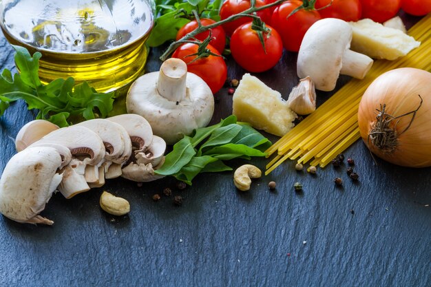 Italian background with tomatoes olive oil mushrooms