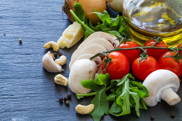 Italian background with tomatoes olive oil mushrooms