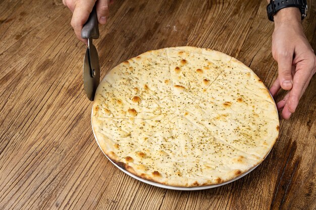 Photo italian bread - focaccia, on a wooden table