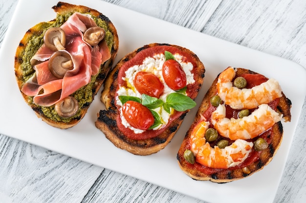 Italian bruschettas with different toppings