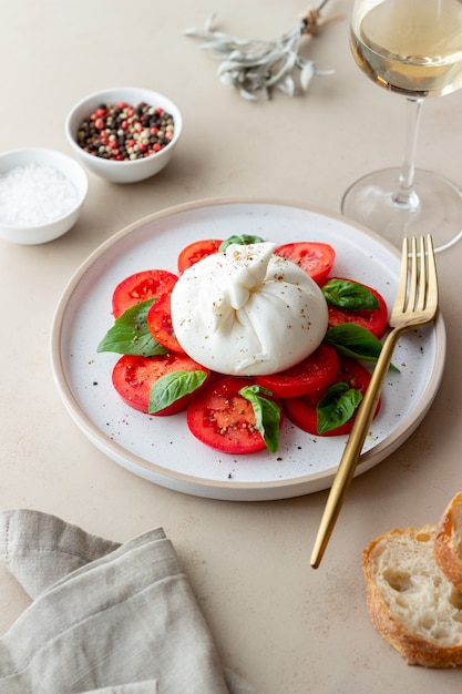 Italian burrata cheese with tomatoes and basil. Salad. Healthy eating. Vegetarian food.