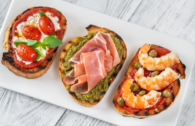 Italian buschettas with different toppings