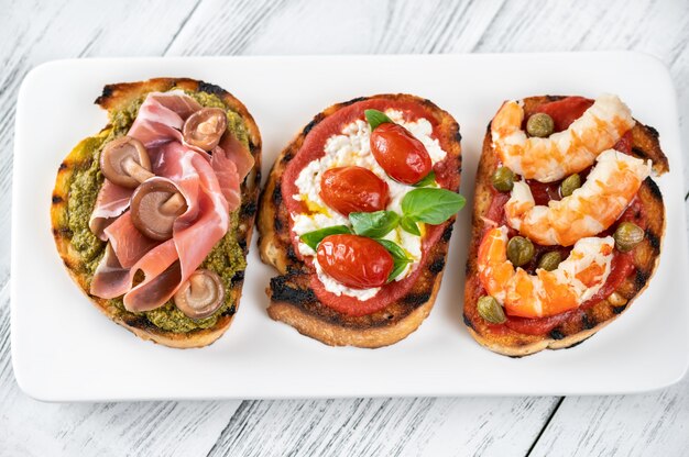 Italian buschettas with different toppings