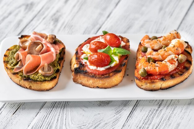 Italian buschettas with different toppings