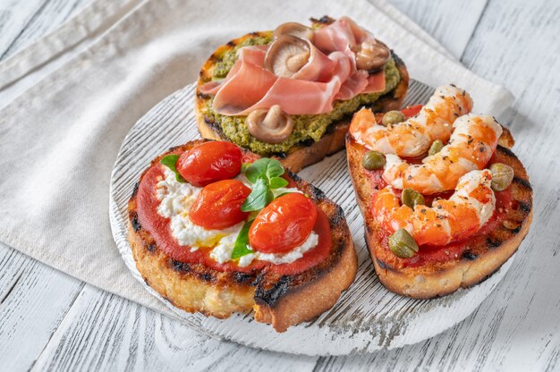 Italian buschettas with different toppings