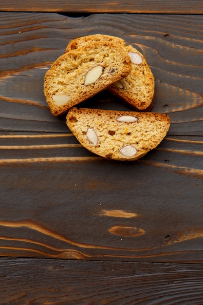 Italian cantuccini cookie with almond filling on wooden table