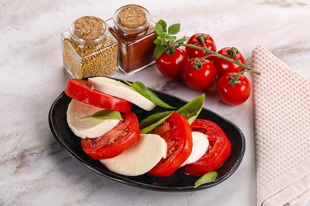 Italian caprese salad with mozzarella tomato and basil