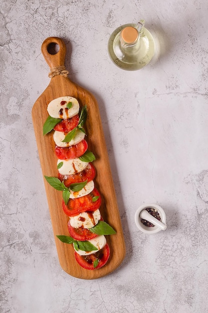 Italian caprese salad with sliced tomatoes mozzarella basil olive oil