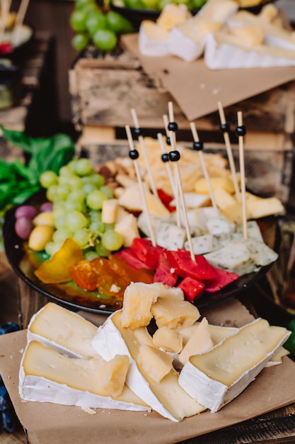 Italian cheese table decor for wedding or birthday flag of\
italy cheese olives lemons grapes and ham