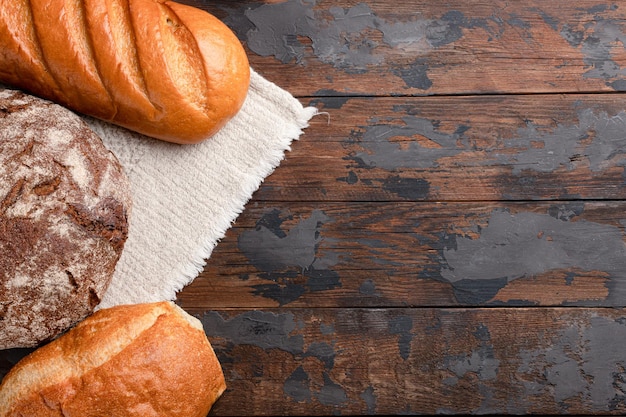 Italian ciabatta rye bread loaf on a wooden background