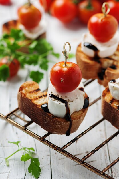 Italian crostini with mozzarella and tomato