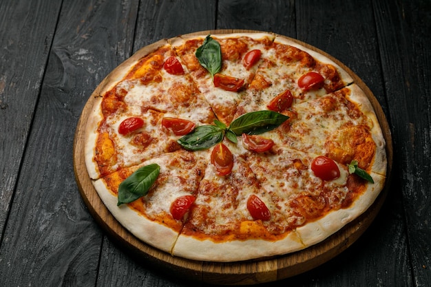 Italian cuisine Pizza on a black table