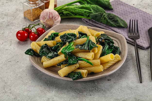 Italian cuisine tortiglioni with spinach