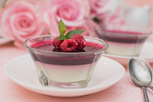 Italian dessert panna cotta with berry sauce, fresh berries.