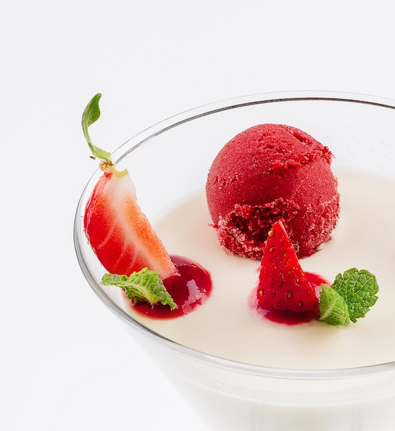 Italian dessert panna cotta with red fresh strawberries