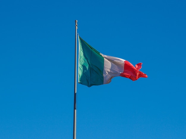 Italian flag over blue sky