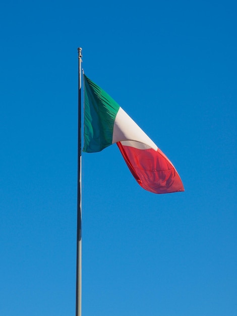 Italian flag over blue sky