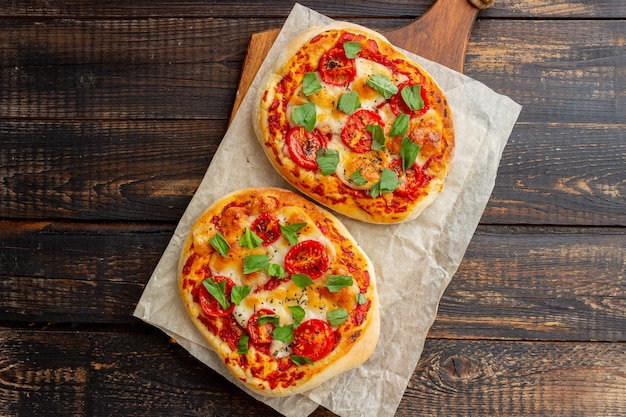 Italian focaccia or pizza with mozzarella, tomatoes and basil.