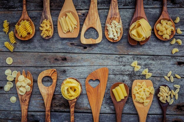 Italian food cooking ingredients on shabby wooden background 