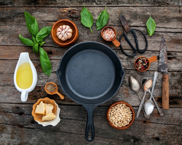 Italian food cooking ingredients with cast iron skillet flat lay and copy space.