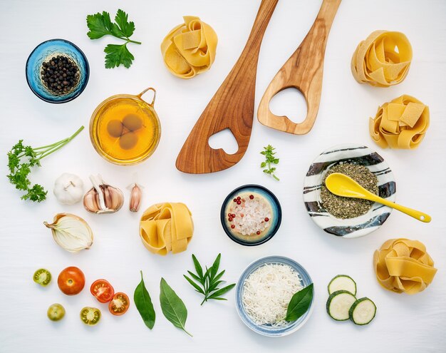 Italian foods concept and menu design. Pasta and ingredients on white background.