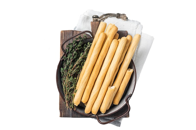 Italian grissini bread sticks in steel tray with herbs isolated white background