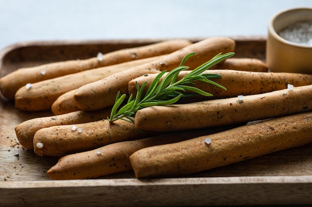 Italian grissini with provencal herbs and sea salt selective focus