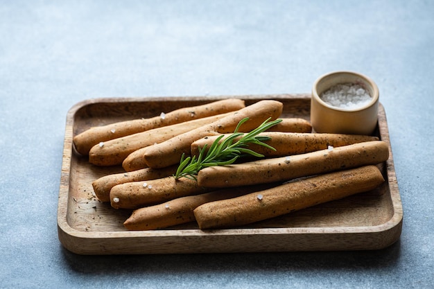 Italian grissini with provencal herbs and sea salt selective focus