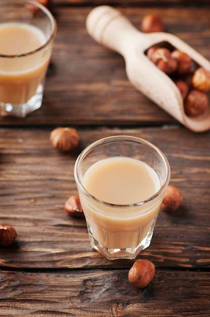 Italian hazelnuts liqueur on the wooden table