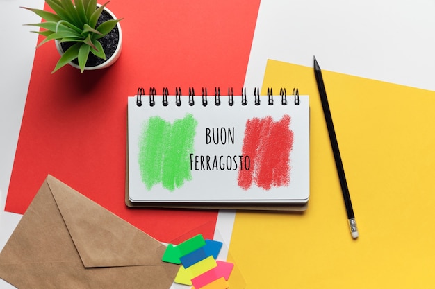 Italian Holiday buon ferragosto drawn on a notebook.