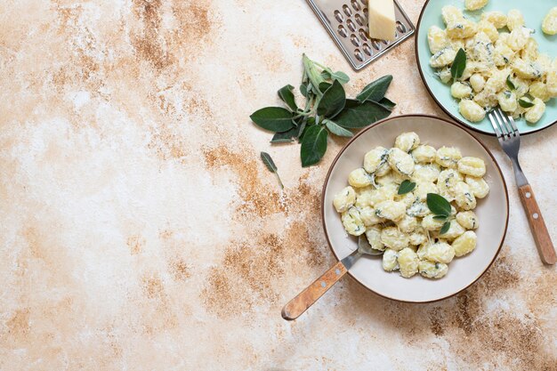 Italian homemade gnocchi with butter, cheese, and sage