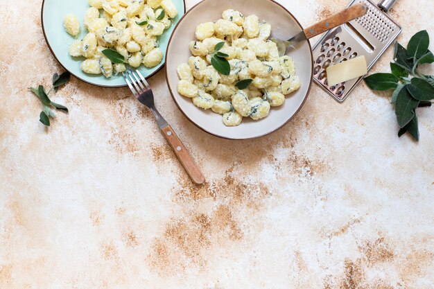 Italian homemade gnocchi with butter, cheese, and sage