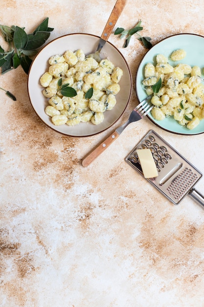 Italian homemade gnocchi with butter, cheese, and sage