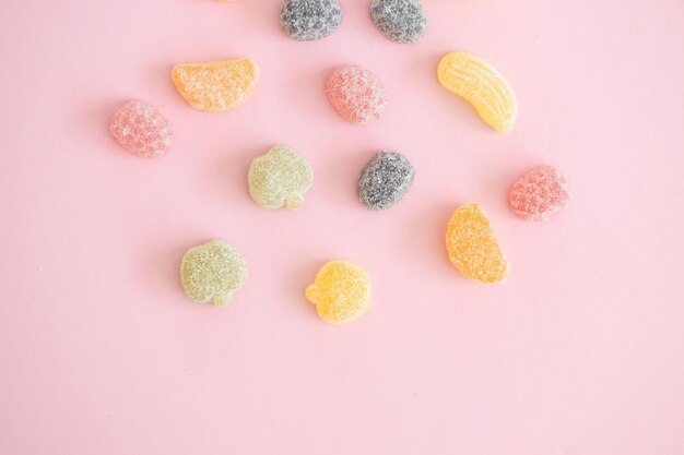 Italian jelly fruit sweets on pink background