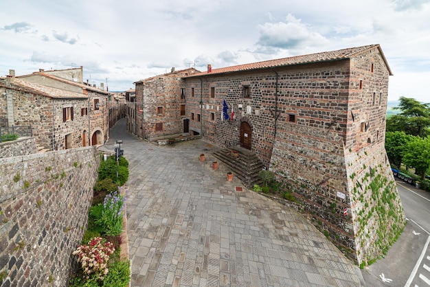 Italian medieval village details historical stone square ancient church abbey old city stone buildings architecture Radicofani Tuscany Italy Radicofani Tuscany Italy