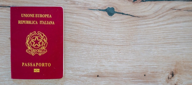 Italian passport on the wood table