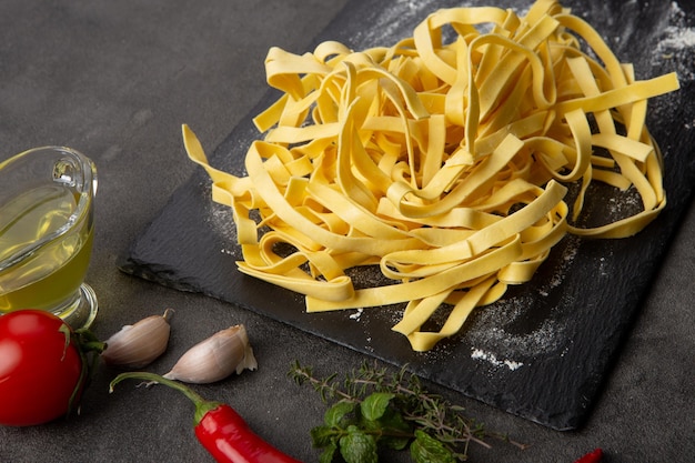 Italian pasta cooking process Fresh food concept Home made tagliatelle