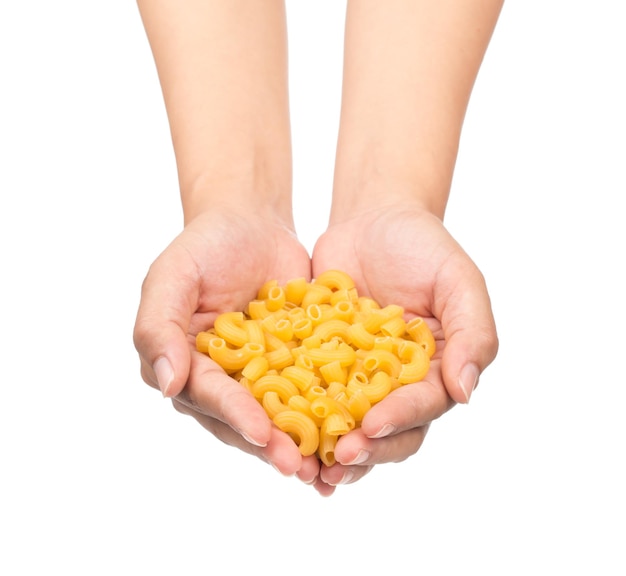 Italian pasta in hand dry pasta isolated on white background