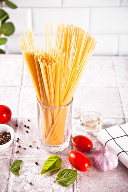 Italian pasta ingredients on kitchen table. Food cooking