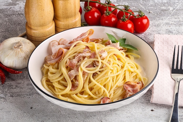 Italian pasta spaghetti Carbonara with bacon