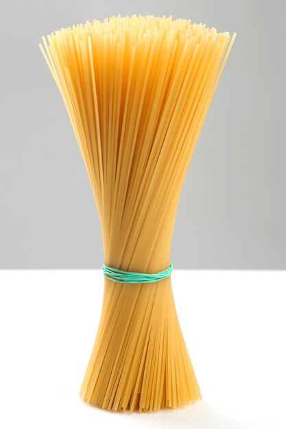 Italian pasta spaghetti on a gray background. flour products and food in cooking