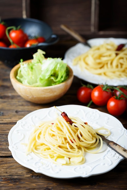 Italian pasta spaghetti with oil, garlic and chili