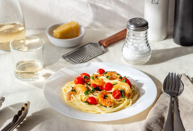 Italian pasta spaghetti with shrimps and tomatoes. National cuisine.