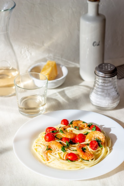 Italian pasta spaghetti with shrimps and tomatoes. National cuisine.