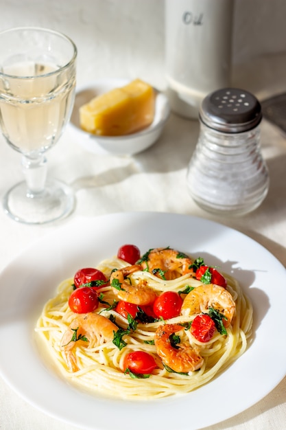 Italian pasta spaghetti with shrimps and tomatoes. National cuisine.