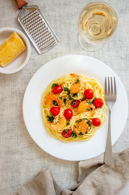 Italian pasta spaghetti with shrimps and tomatoes. National cuisine.