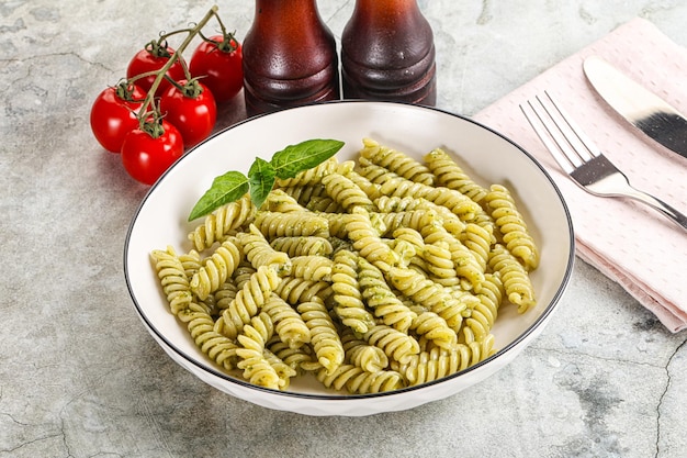 Italian pasta with basil pesto saiuce