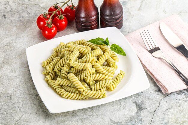 Italian pasta with basil pesto saiuce