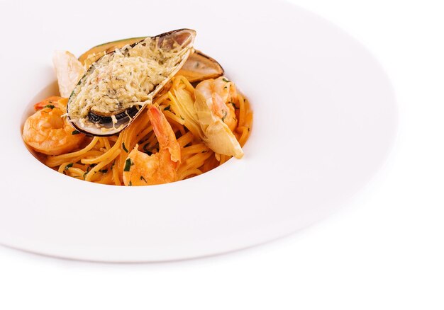 Italian Pasta with seafood isolated on white